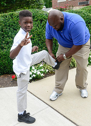 student getting help with his shoes - private special education school Titsville Academy in Hopewell NJ